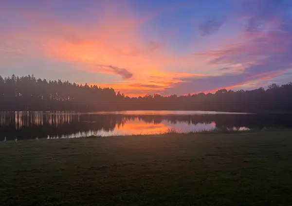 Sunset over the water, seen from the lawn